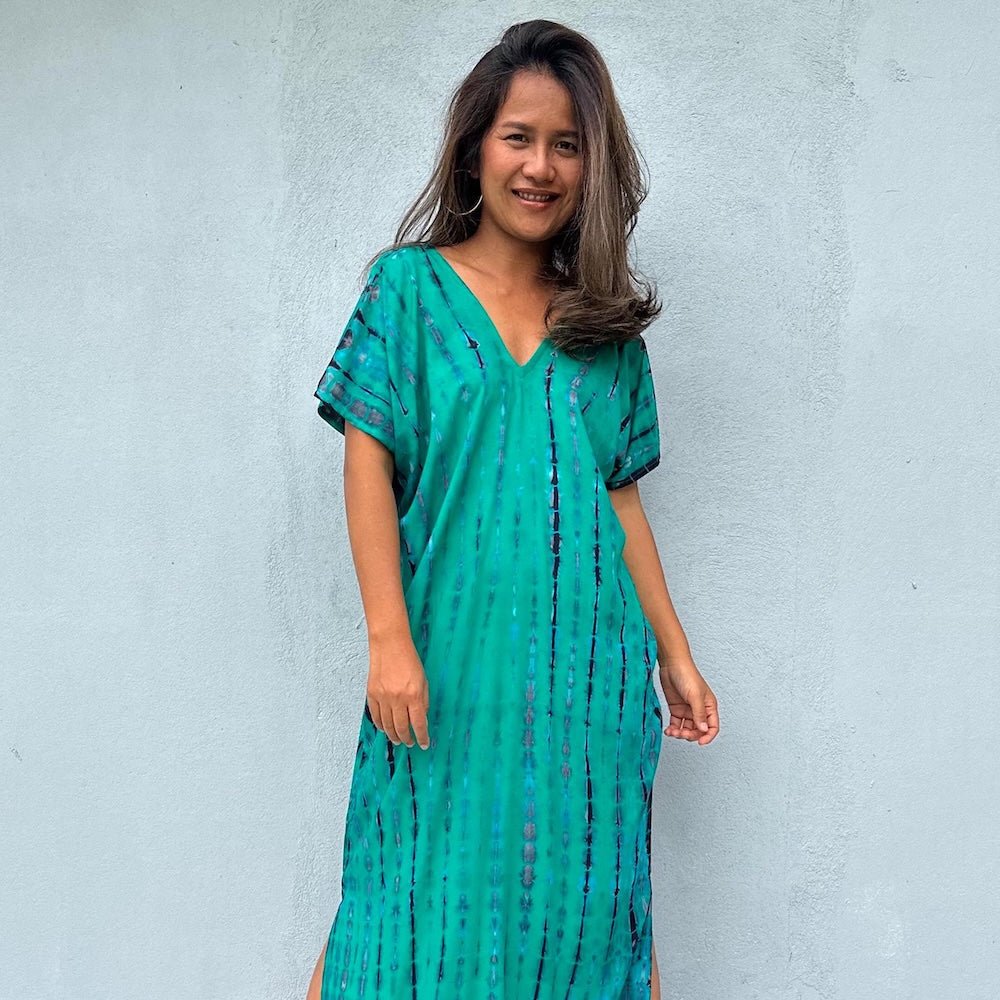 Petite kaftans Collection - woman wearing turquoie tie dye kaftan