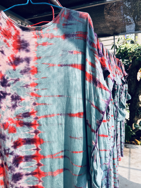 blue tie dye kaftans hanging to dry